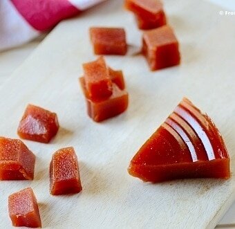 chopped morsels of guava paste on a white plate