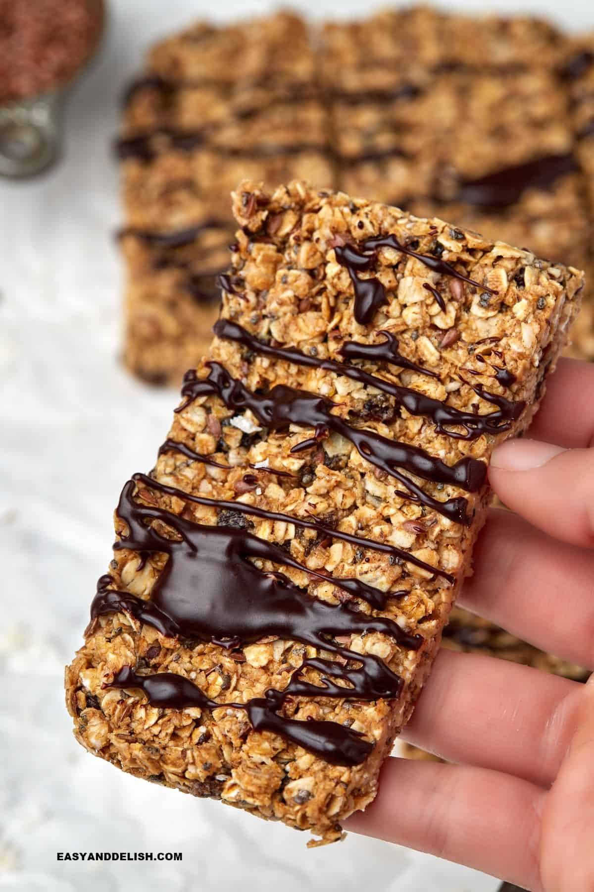 a homemade energy bar held by a hand.