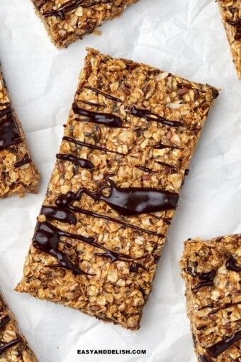 Close up of homemade energy bars drizzled with melted chocolate.