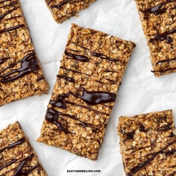 Close up of homemade energy bars drizzled with melted chocolate.