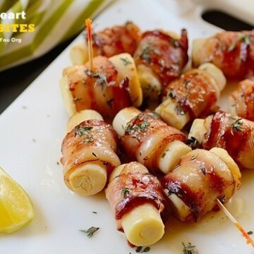 A tray of hearts of palm on skewers wrapped with bacon
