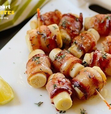 A tray of hearts of palm on skewers wrapped with bacon