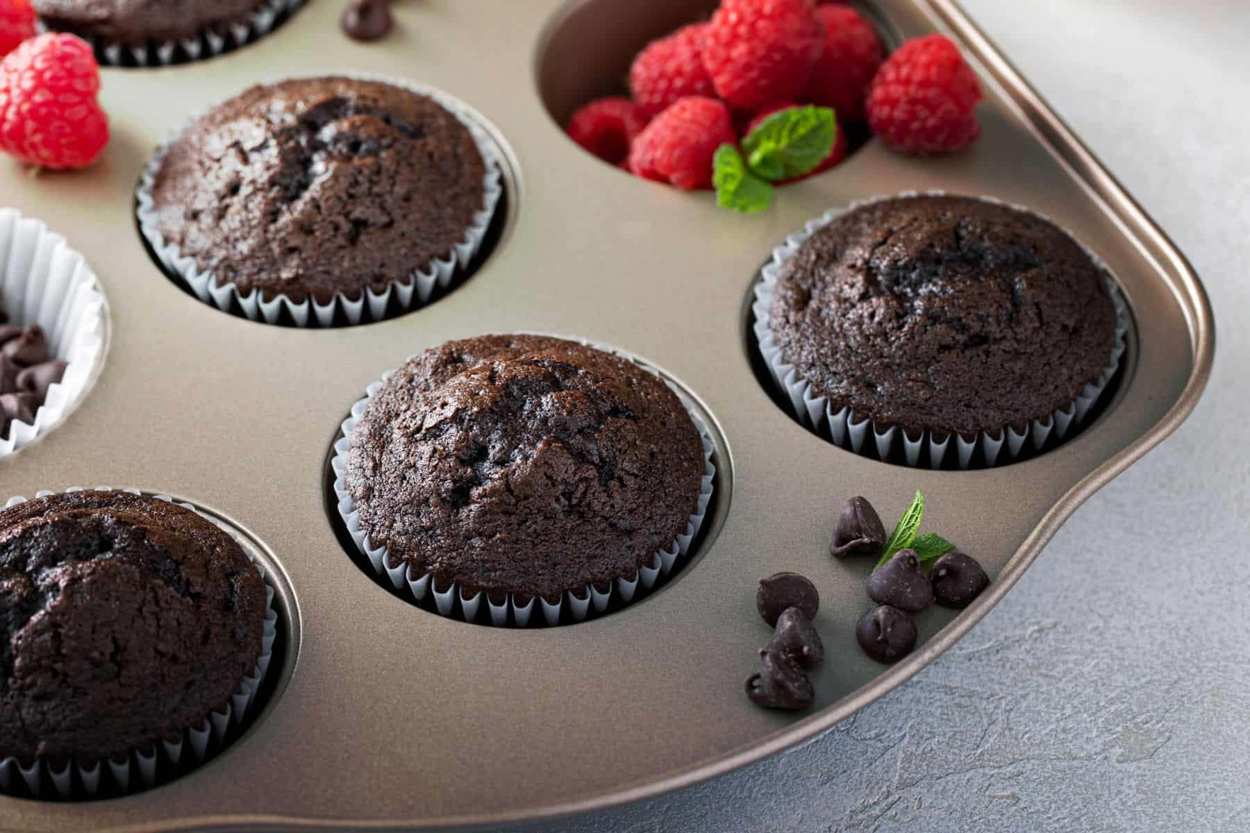Chocolate cupcakes in a muffin pan. 