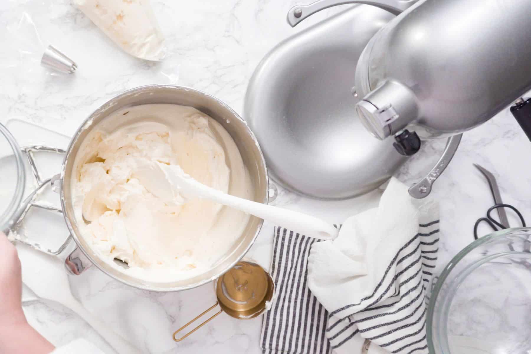Cream cheese frosting mixed in a stand mixer. 