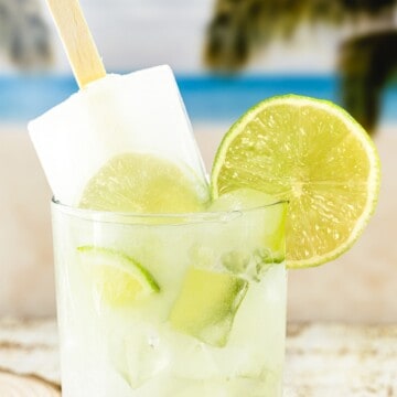 A glass of Brazilian lemonade with a popsicle inside