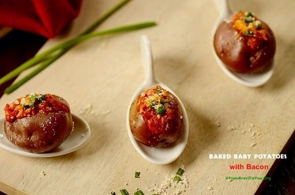 Baked baby potatoes with bacon on a table