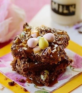 Easter cookie bars topped with pastel chocolate mini easter eggs