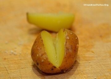 cooked baby potato with a wedge cut into it