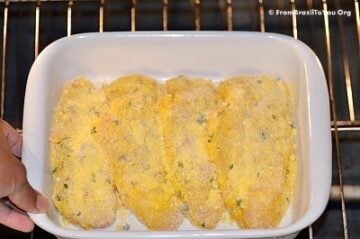 A close up of raw chicken in a plate