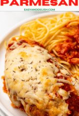 baked chicken parmesan on a plate with pasta