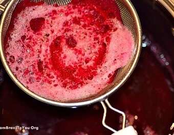 A metal pot with red beet juice