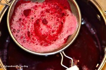A metal pot with red beet juice