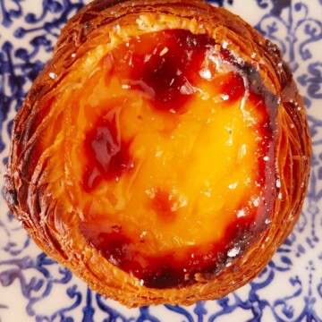 close up of pastel de nata over a plate