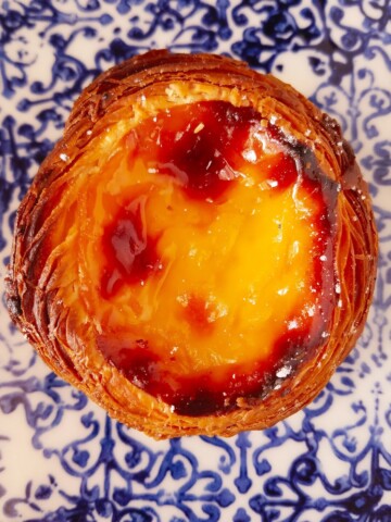 close up of pastel de nata over a plate