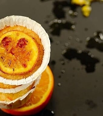 A stack of queijadinhas de laranja or Brazilian Orange Coconut Muffins