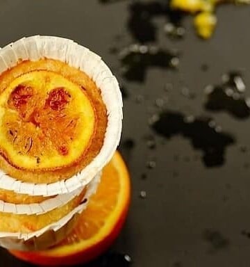 A stack of queijadinhas de laranja or Brazilian Orange Coconut Muffins