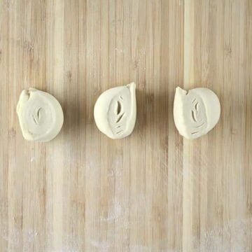 puff pastry dough cut into pieces and ready to be molded into tart tins