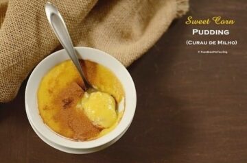 a spoon full of corn pudding in a bowl