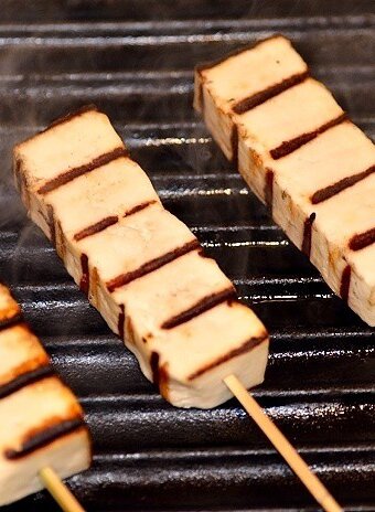 grilled cheese sticks with grill marks cooking on the grill