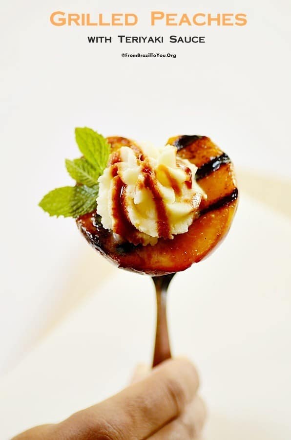 a grilled peach with mascarpone stuck in a fork