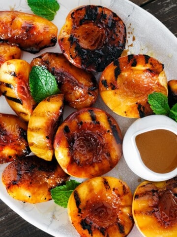 grilled peaches with honey in a platter