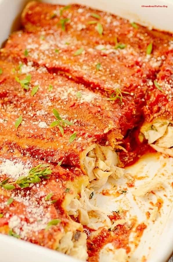 A close up of a plate of food with a slice of pizza