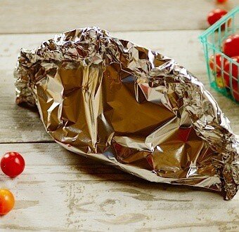 fish stew sealed in the aluminum packets (en papillote)