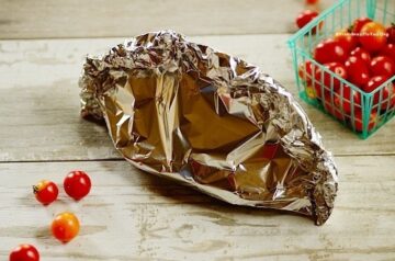 fish stew sealed in the aluminum packets (en papillote)