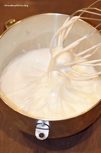 egg whites being beaten into a meringue in a bowl