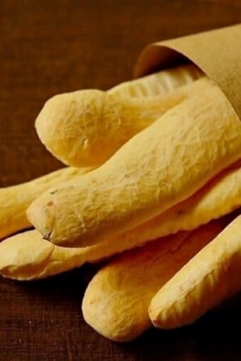 gluten-free breadsticks made with tapioca flour in a paper bag