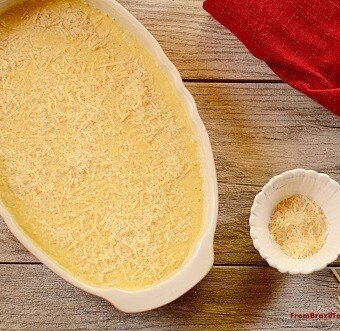 Creamy corn gratin in a white baking dish