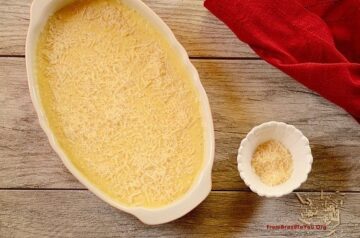 Creamy corn gratin in a white baking dish