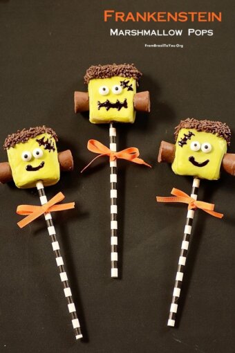 Three completed frankenstein marshmallow pops with orange bows