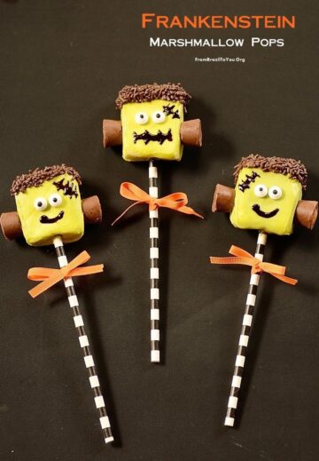 Three completed frankenstein marshmallow pops with orange bows