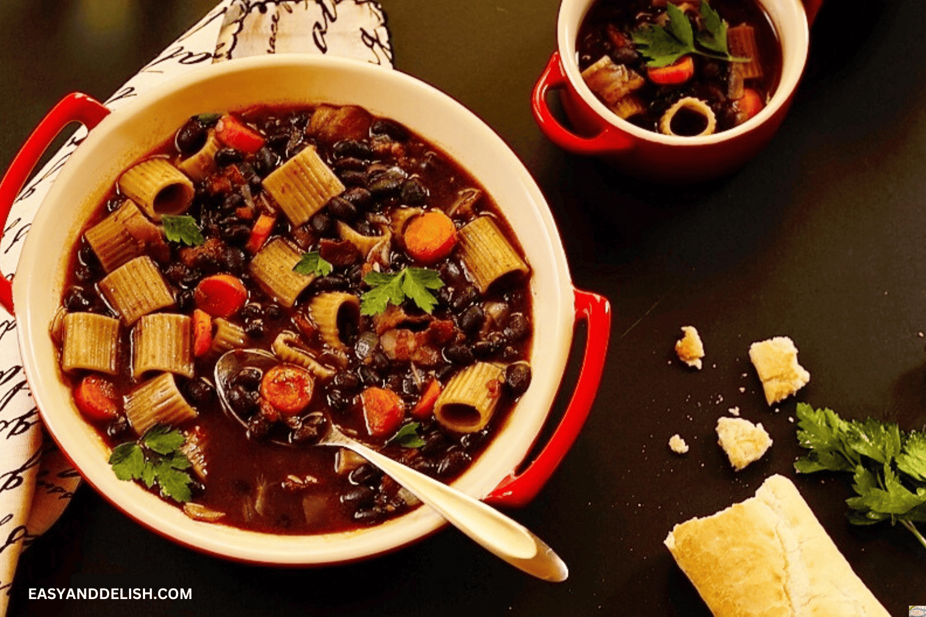 Hot dinner served in bowls with bread on the side. 