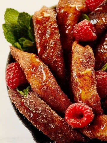 rabanadas in a skillet with berries