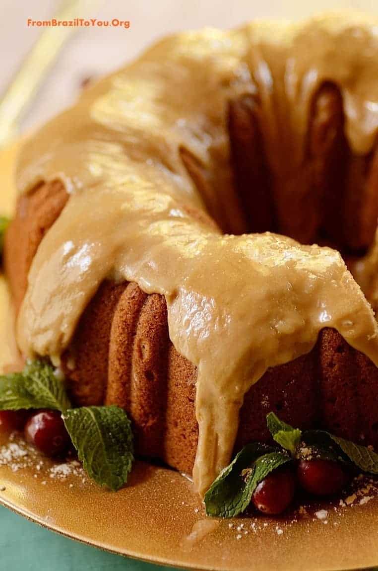 A close up of a caramel frosted cake