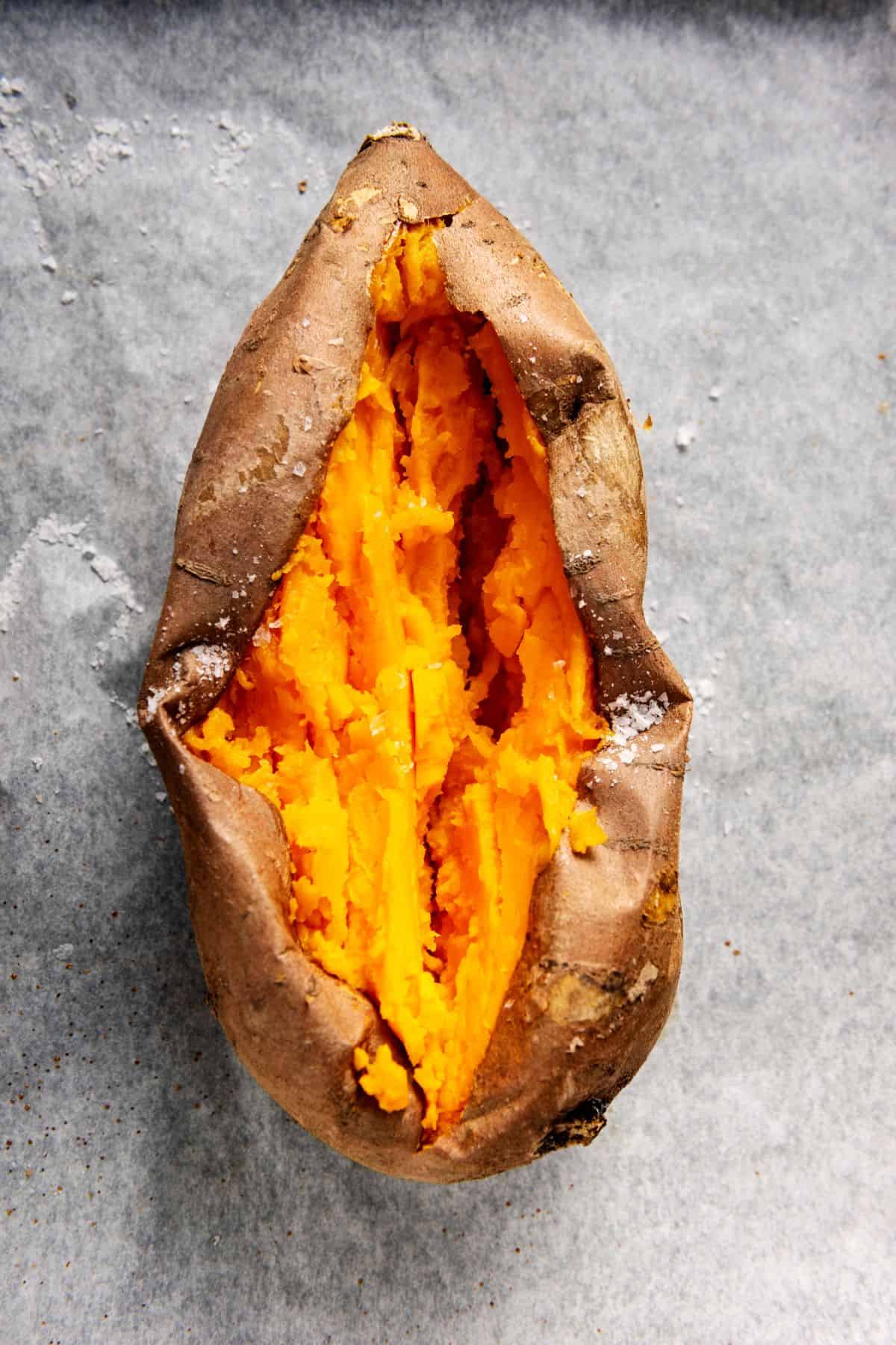 Cooked sweet potato split open. 