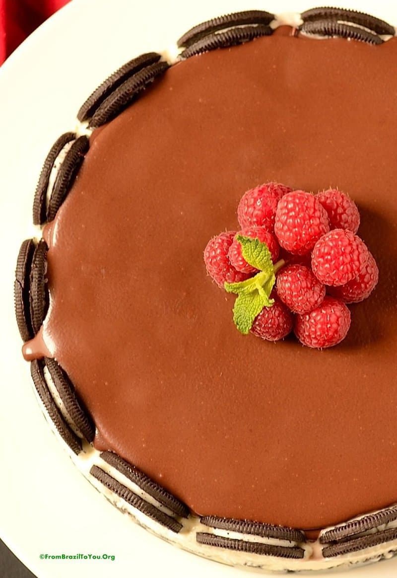 A chocolate cream pie topped with raspberries