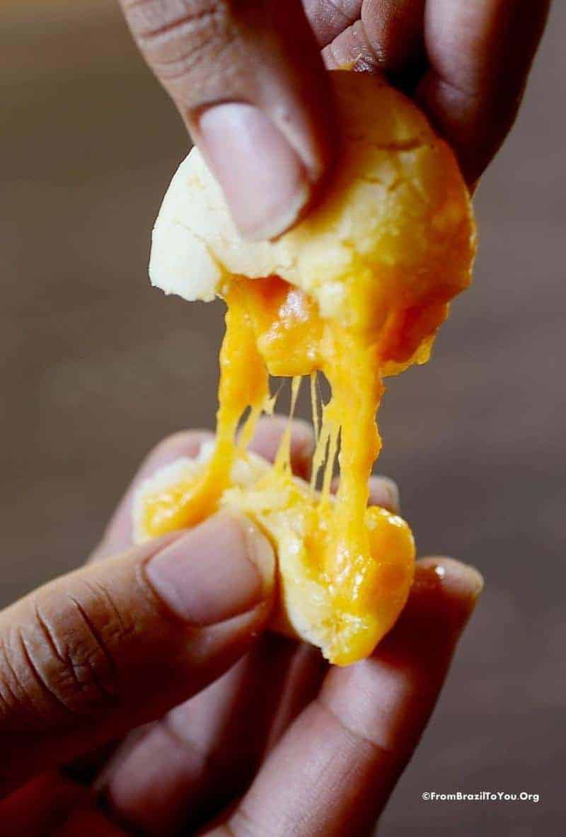 pulling melting cheese inside a cheese roll