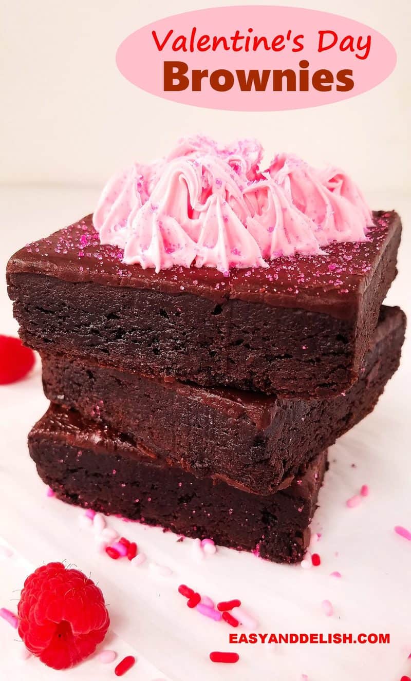 a pile of valentine's brownies with berries on the side