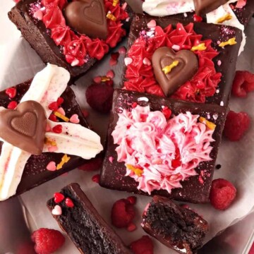 several valentine's day brownies in a platter