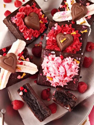 several valentine's day brownies in a platter