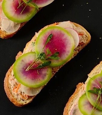 Open-faced tuna sandwiches with radish slices