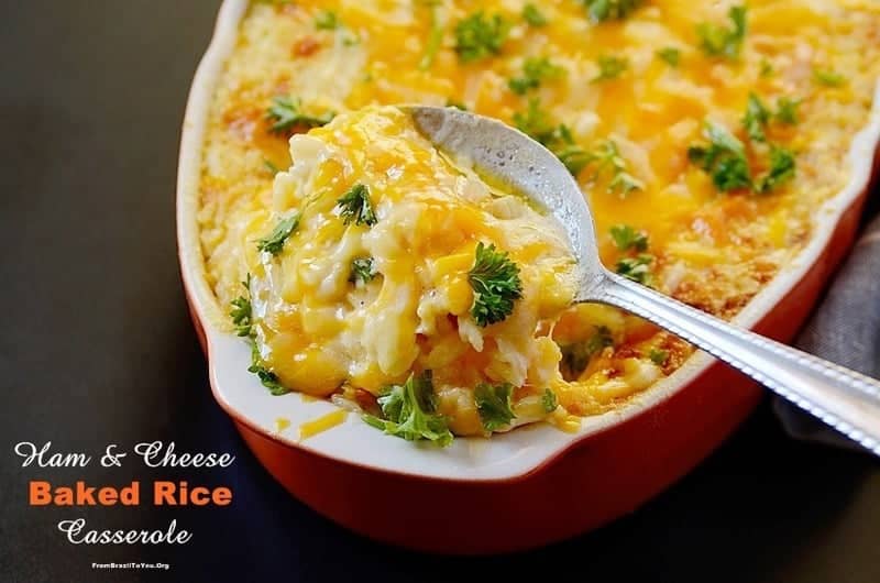 Horizontal image of ham and cheese baked rice in a baking dish