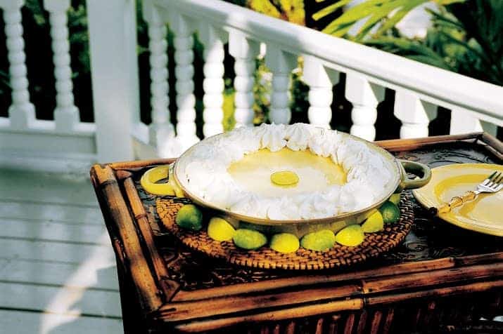 A key lime pie sitting on top of a wooden table