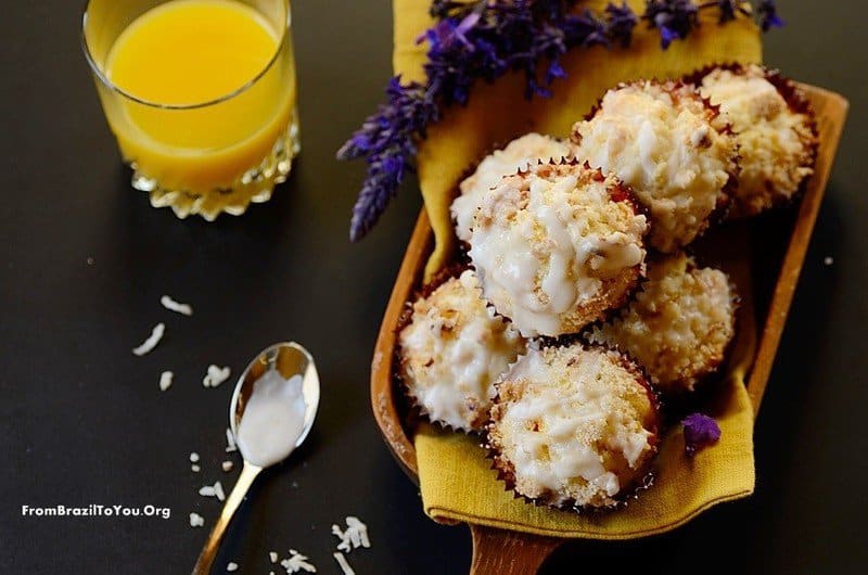 Mango Coconut Streusel Muffins in a platter with juice on the side