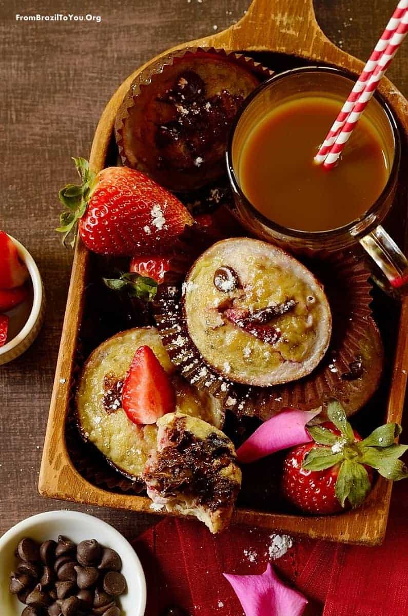 A breakfast tray of muffins with coffee