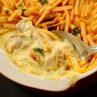 Creamy brazilian chicken fricassee served with shoestring potatoes