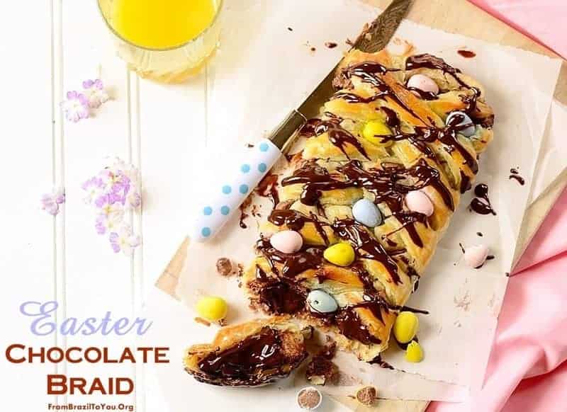 Easter chocolate puff pastry braid partially sliced. 